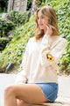 SMILEY SLEEVE KNIT SWEATER